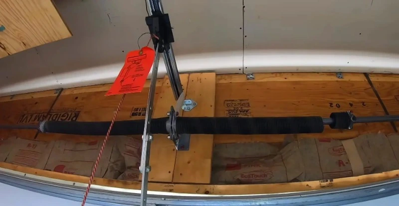 Broken torsion spring on a residential garage door in Myrtle Beach before repair